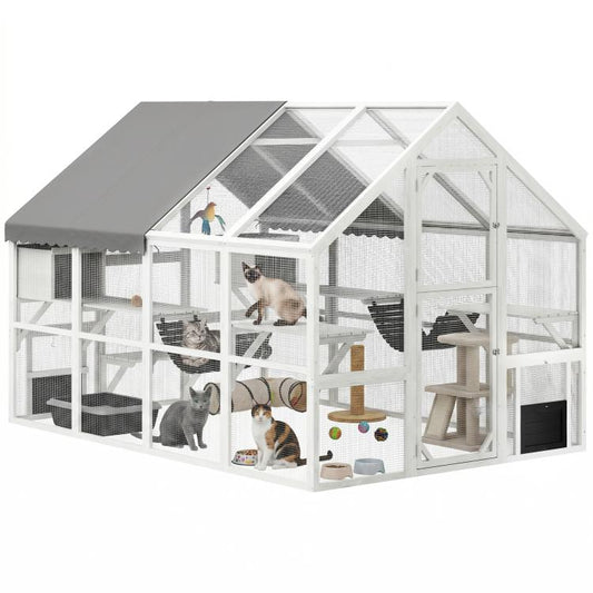 White outdoor wooden cat enclosure with gray roof, platforms and multiple condos