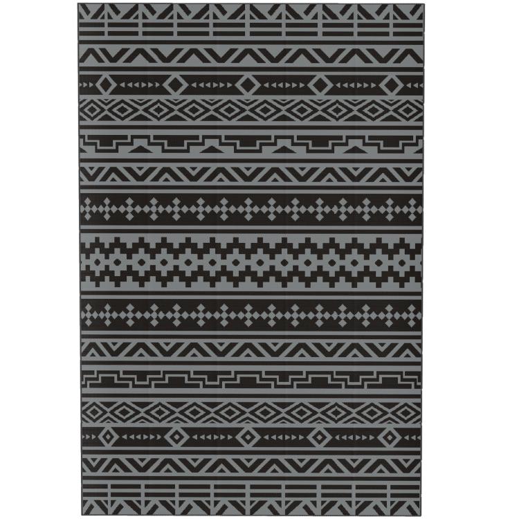 Outdoor geometric rug close-up with black and gray patterned bands