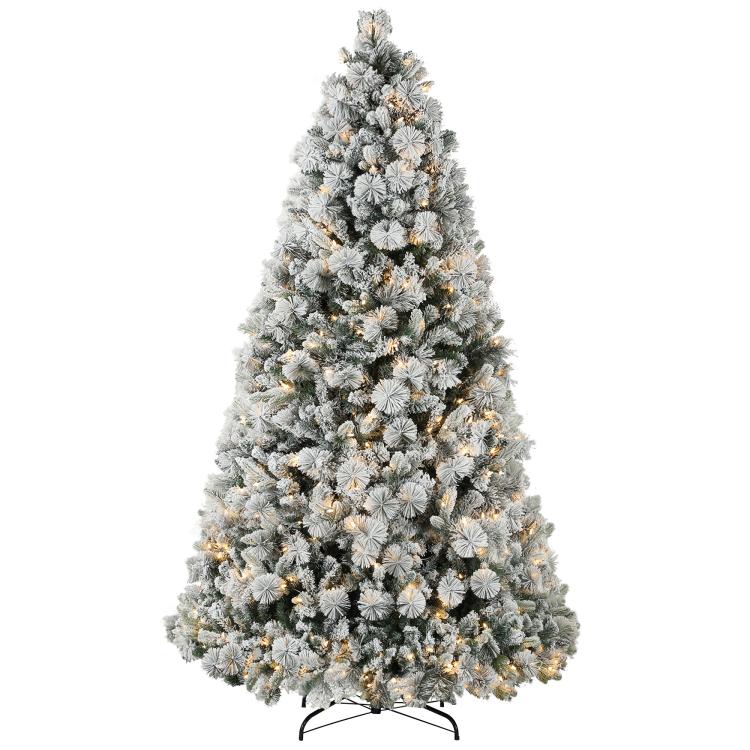 Flocked prelit artificial Christmas tree with clear lights on metal stand, full view