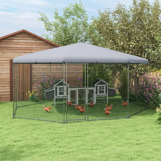 Outdoor chicken run with gray cover and wire mesh walls; chickens inside
