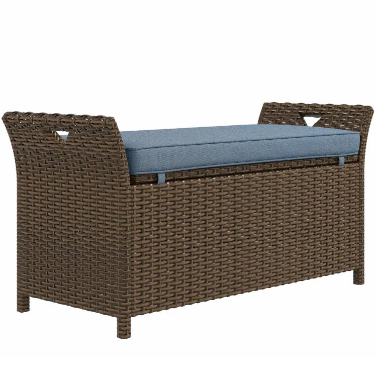 Wicker storage bench with dark blue cushion and hinged lid