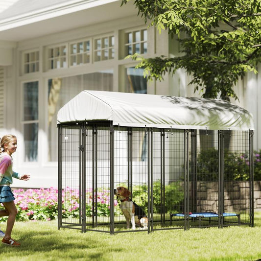 Outdoor dog kennel with roof, black wire pen with dog inside in backyard