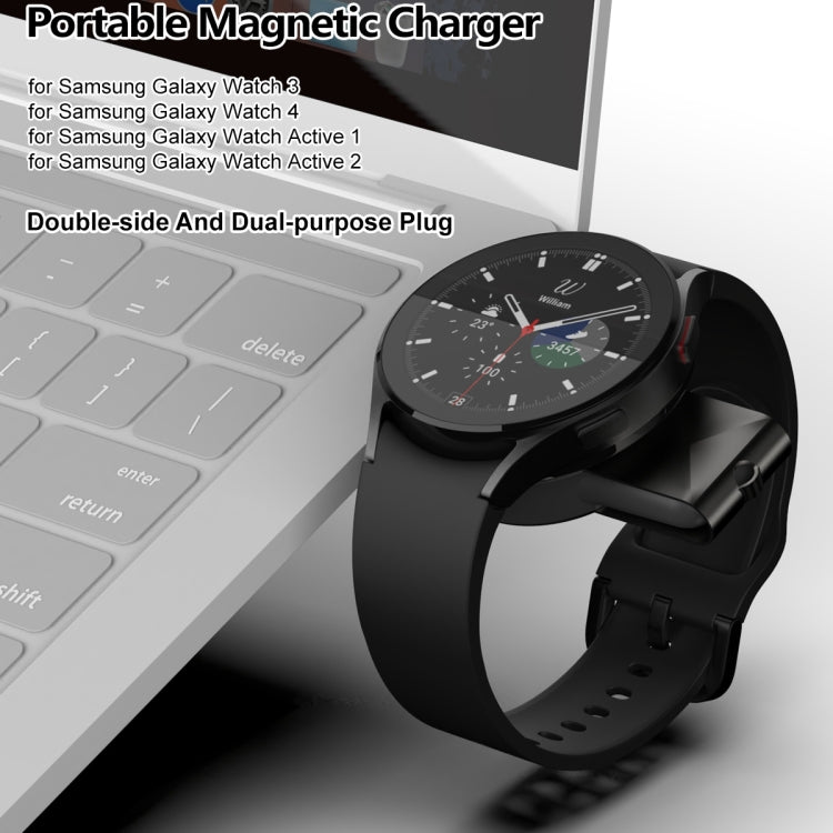 Portable magnetic wireless watch charger with black watch strap and round charging puck