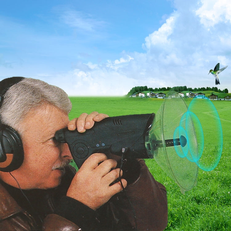 Man using handheld electronic listening device with clear ear horn outdoors