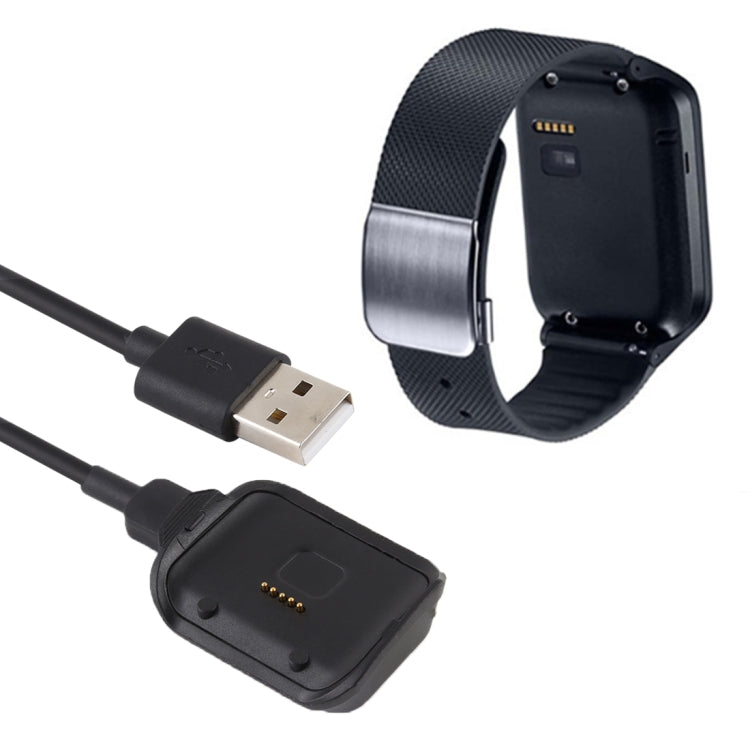 Smart watch on black charging cradle dock connected to USB-A cable
