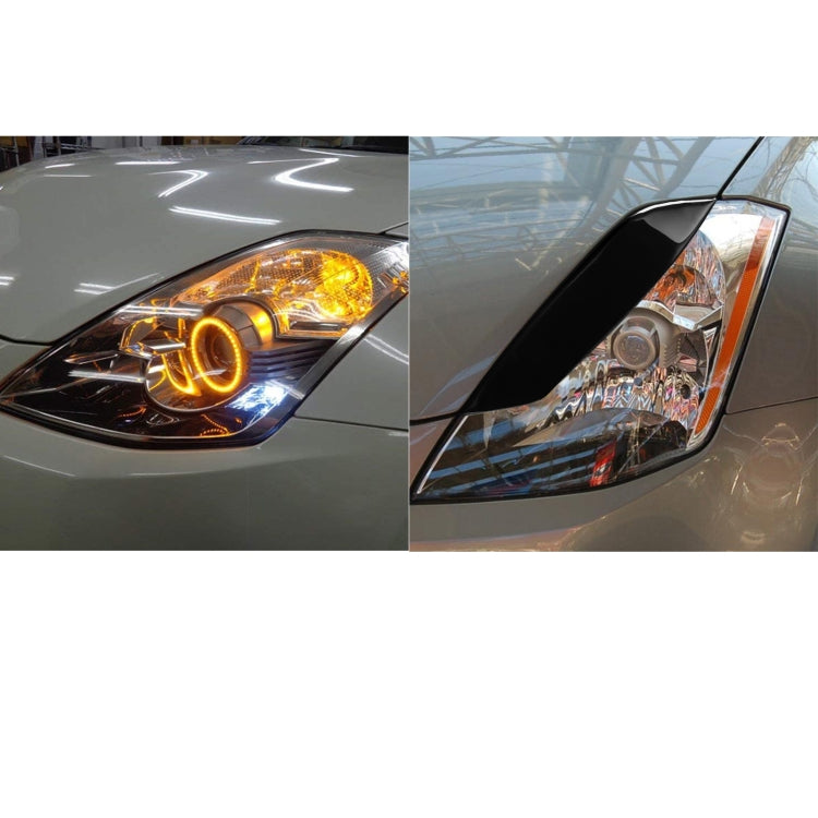 Black ABS headlight eyebrow trim with clear turn-signal lens and reflector