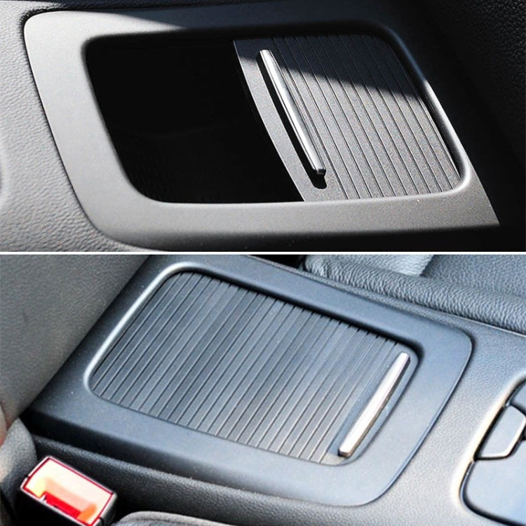Installed ribbed cup holder cover insert with silver handle slot in center console
