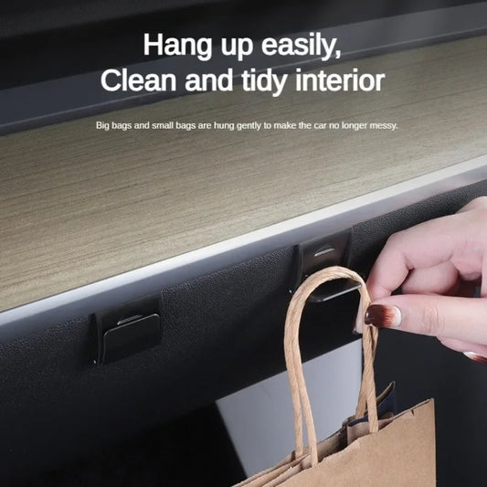 Glove box hidden hook with hand hanging a shopping bag