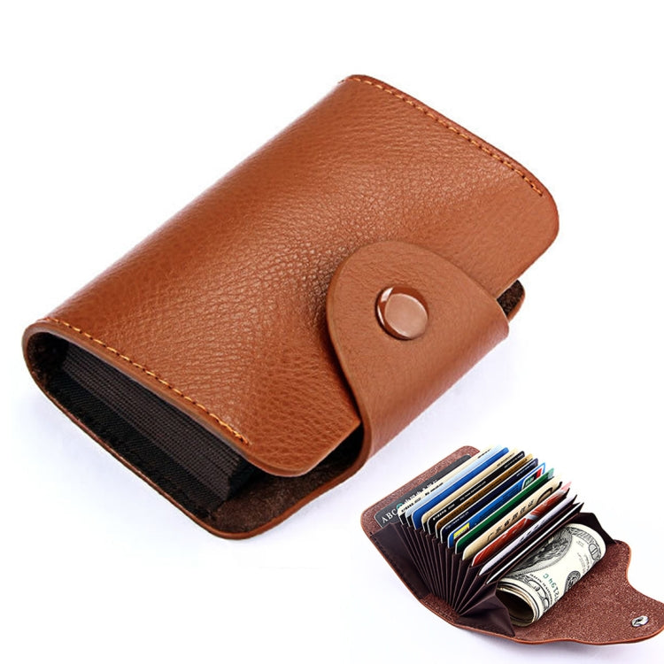 Tan/brown genuine leather card holder with snap flap closure and card slot opening.