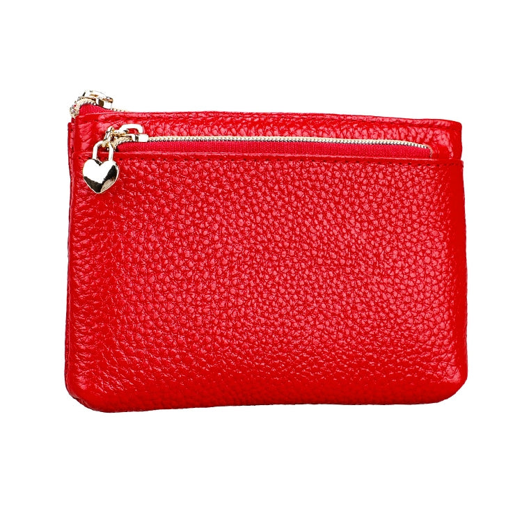 Red textured leather wristlet wallet with zipper and small heart charm detail