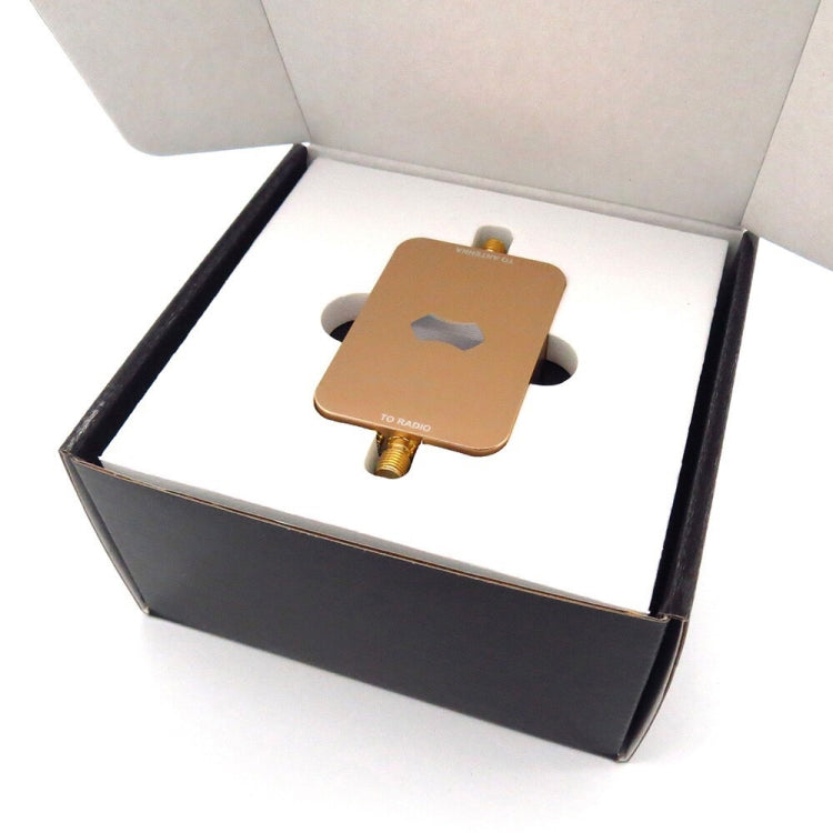 Wireless WiFi signal booster amplifier in open box, copper-toned metal case with ports