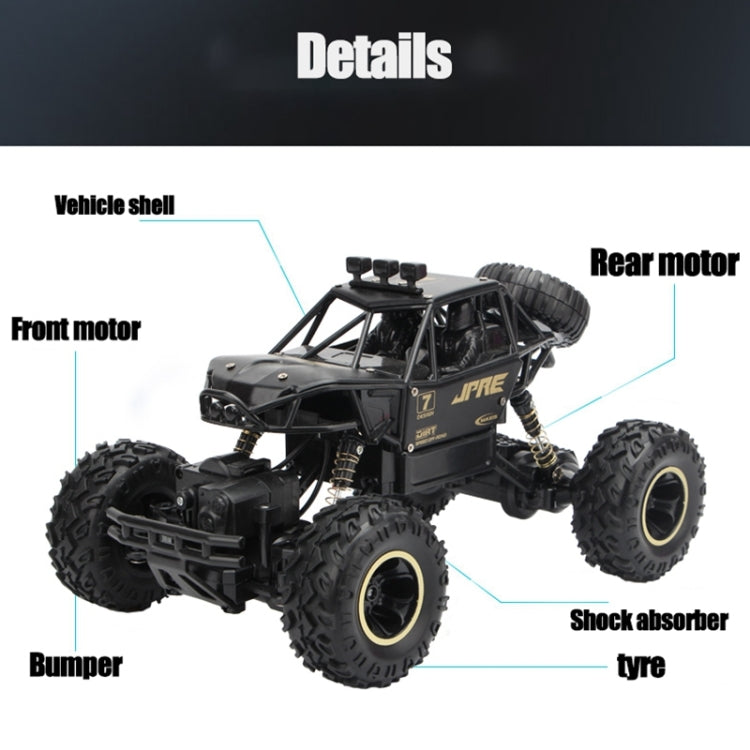 Black off-road remote control climbing car with knobby tires, bumper, and shock absorber