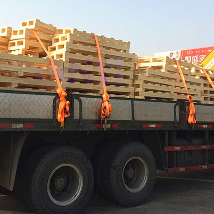 Orange ratchet tie-down straps with hooks securing a pallet load on a truck