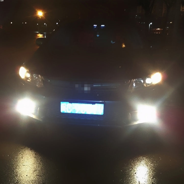 Car front view with fog lights glowing bright white light