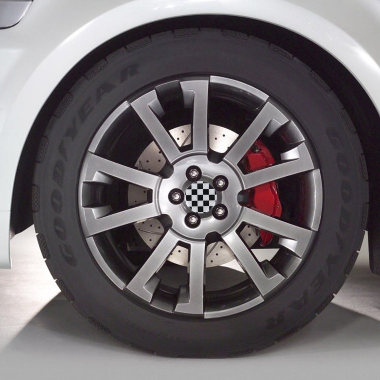 Wheel with round black-and-white checker-pattern hub center cover