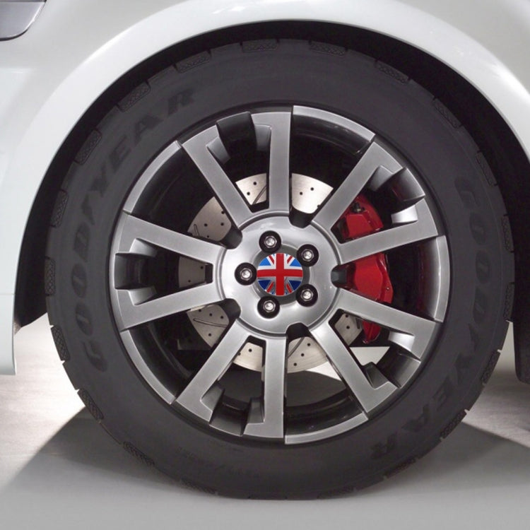Car wheel center cover sticker featuring Union Jack on a silver alloy rim.