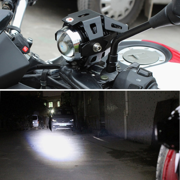 Installed black U5 LED motorcycle headlight lamp with illuminated beam