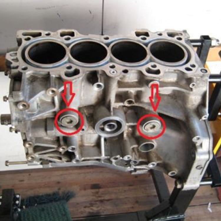 Engine block view with marked openings for rear breather adapter fittings