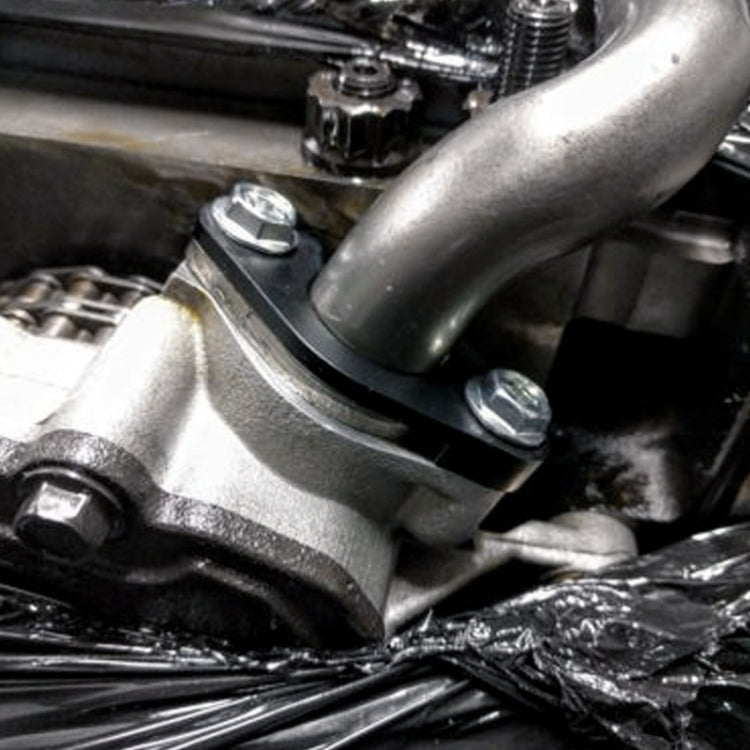 Installed billet oil pump sensor tube bracket near engine components with two bolts
