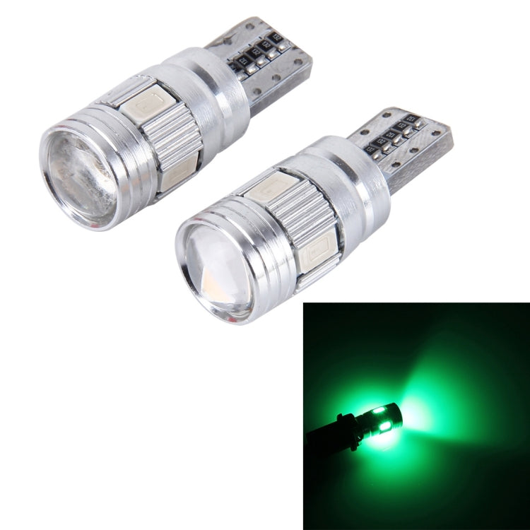 Pair of T10 LED car bulbs with silver housing, green light beam shown