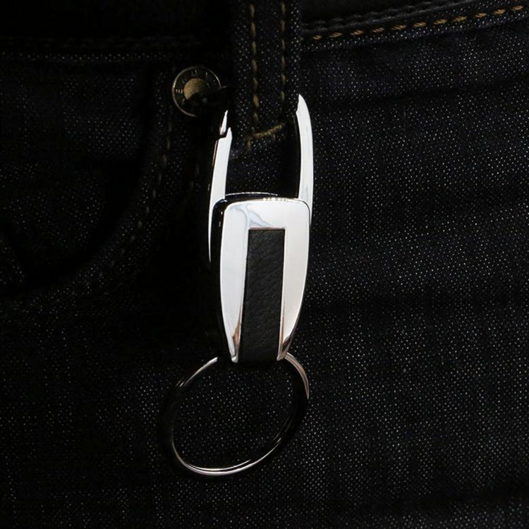 Close-up: metal clip key chain with leather strap and single round key ring
