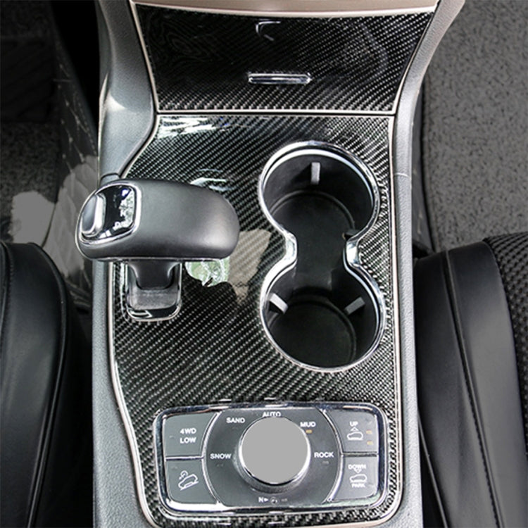 Carbon fiber-look console cup holder panel trim sticker installed around twin cup holders
