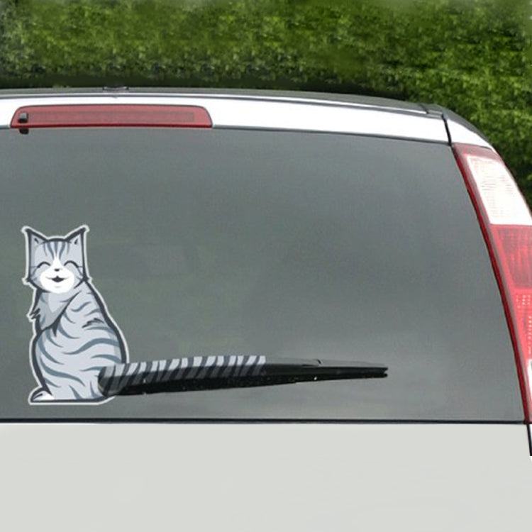 Reflective vinyl cat decal on rear window, frowning face and striped tail