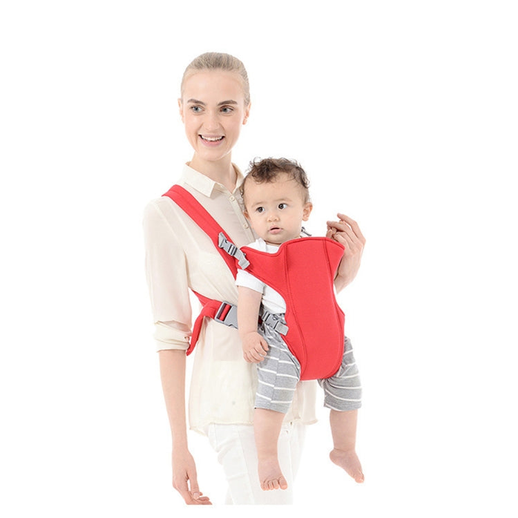 Red infant kangaroo carrier backpack with baby seated in front, standing carry