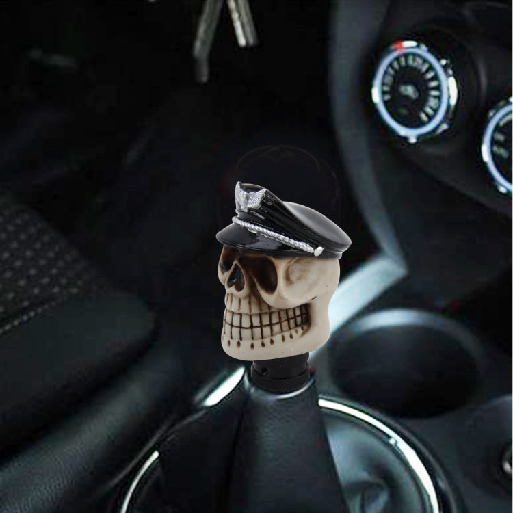 Resin skull gear shift knob with silver sailor-style hat and textured base