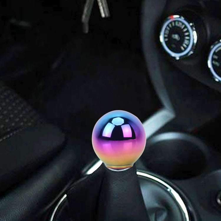 Installed rainbow gradient gear shift knob on a black manual-style shift boot