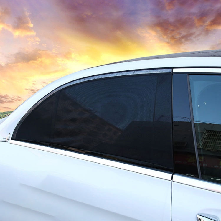 Black mesh rear side window sunshade cover installed on a car door window
