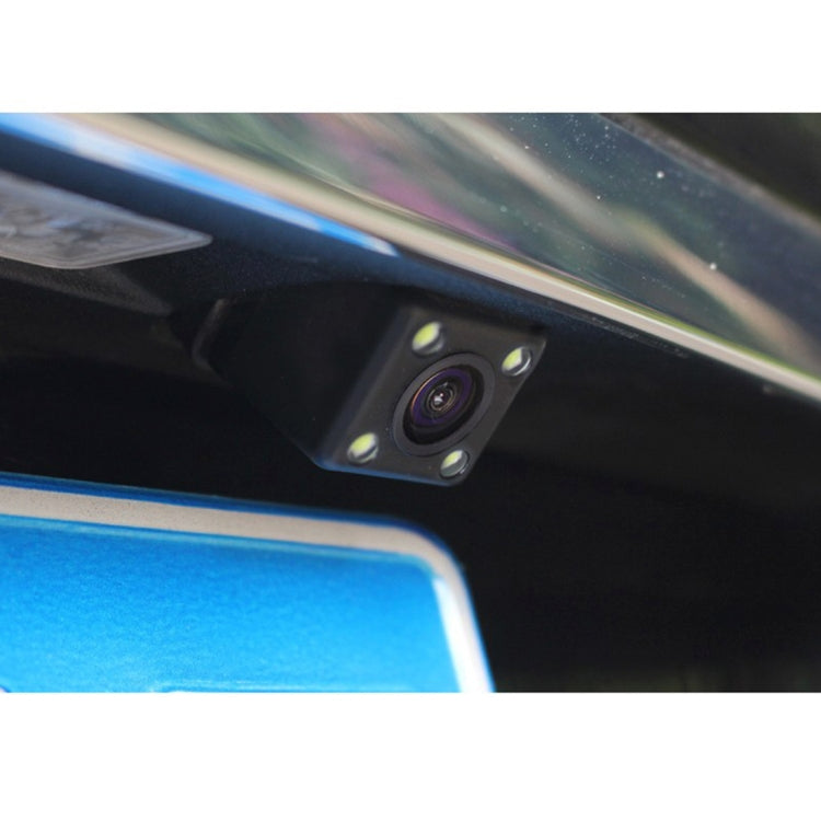 Vehicle rear camera module with lens and mounting screws, under car panel