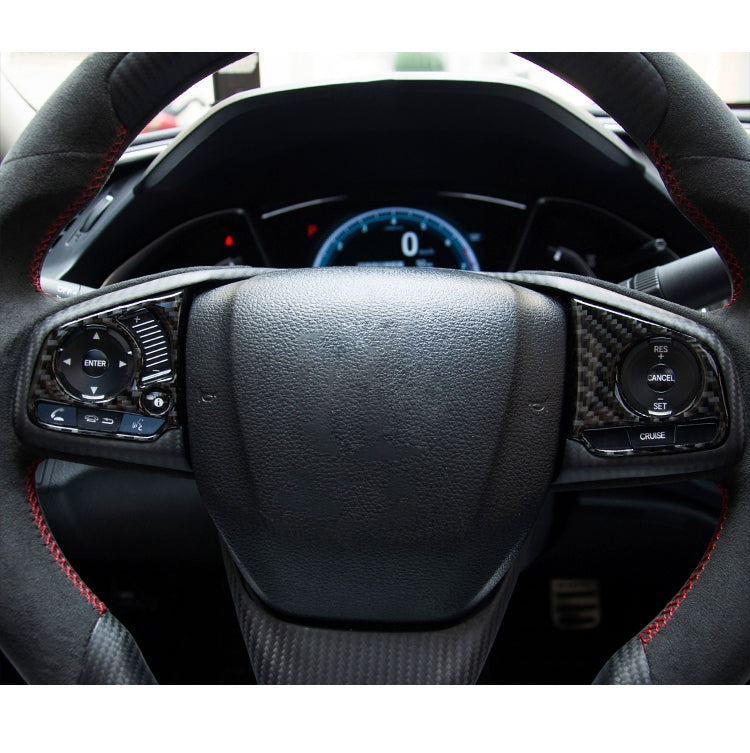Steering wheel with installed carbon fiber button trim on left and right control areas