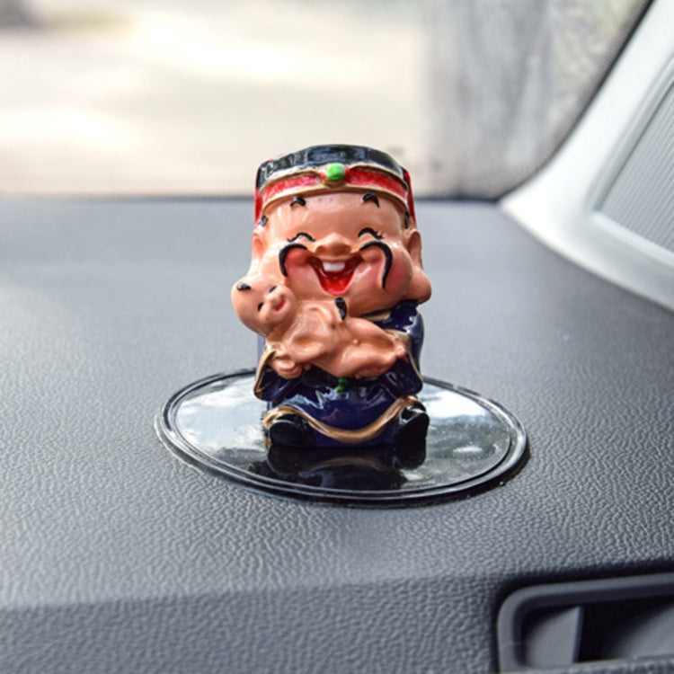 Round transparent anti-slip rubber mat for car dashboard with small figure centered