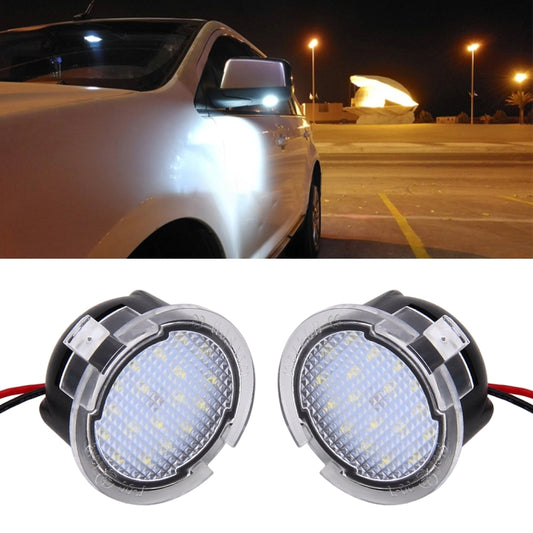 LED puddle light on side mirror area, glowing white.
