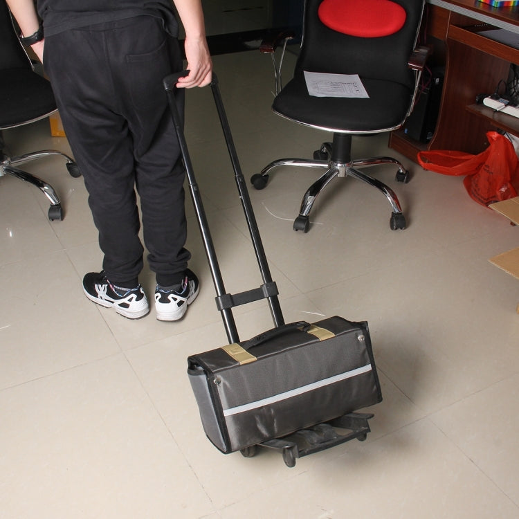 Black folding luggage cart in use with extended handle and platform base