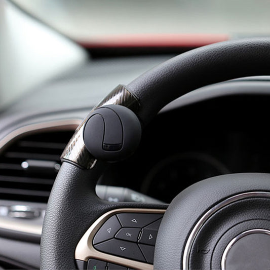Black steering wheel spinner knob booster, rounded control ball on mounting clamp