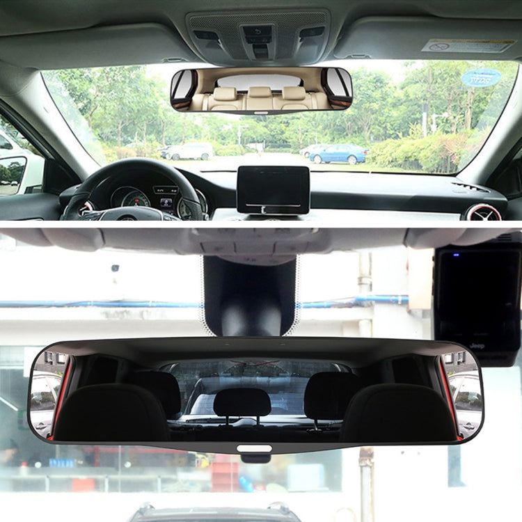Car rearview blind spot mirror installed overhead, small dark curved mirror