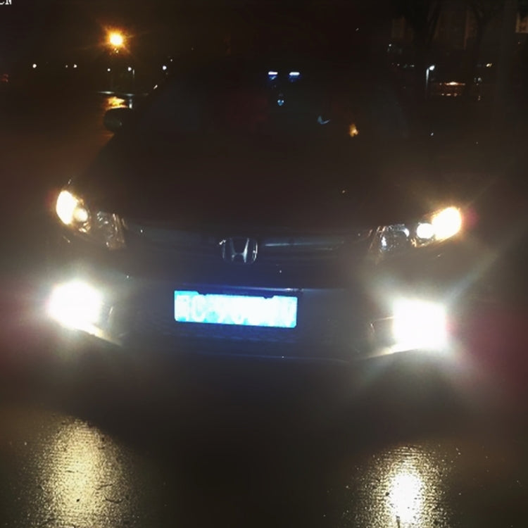 Vehicle front lights shining bright white, indicating clearance bulb illumination