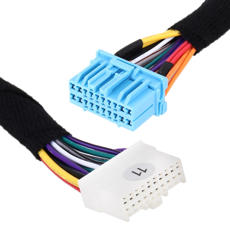 Radio wiring harness connectors: blue plug and white plug with multicolored wires on black