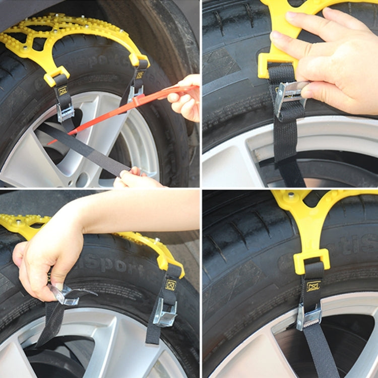 Hands installing yellow snow chain on tire, securing black strap with silver buckle clips