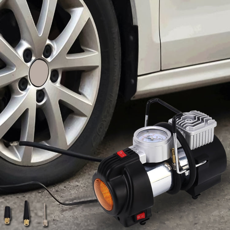 Portable 12V tire air compressor with pressure gauge and orange work light