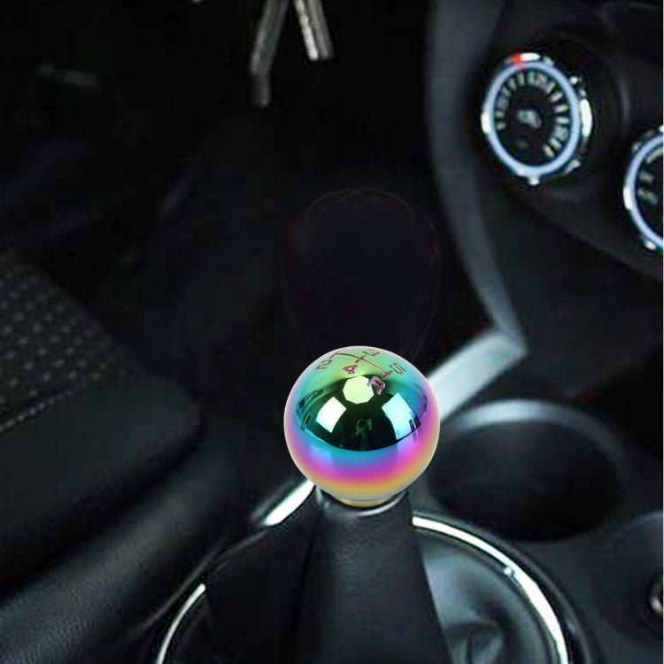 Rainbow metallic spherical gear shift knob shown in car interior