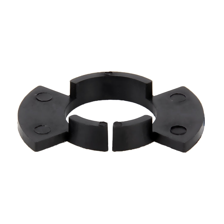 Black plastic headlight bulb retainer adapter with central ring and three mounting tabs