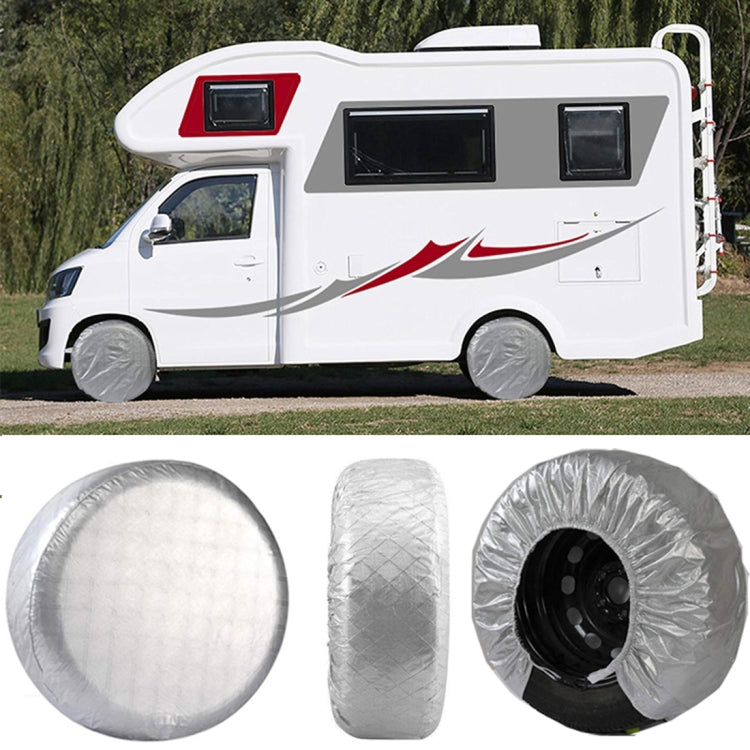 Silver wheel tire covers on vehicle wheels, round covers with elastic openings and hooks.
