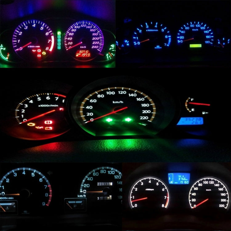 Vehicle instrument cluster gauges with green and blue backlit indicators and numbers
