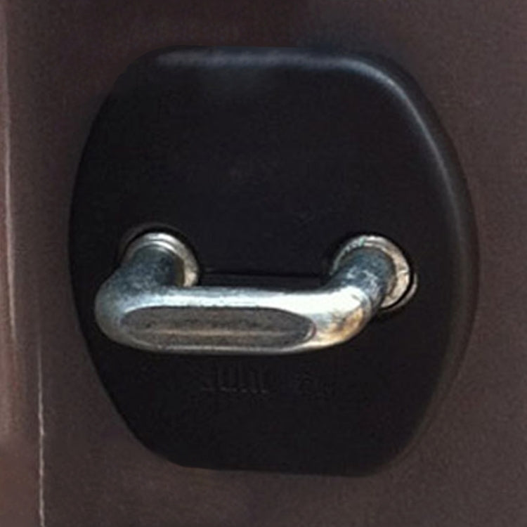 Installed black car door lock protection cover over metal lock latch pin