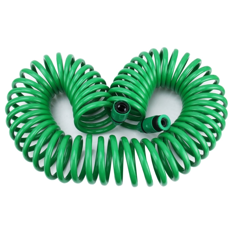 Green telescopic spiral hose folded into double loop with connector