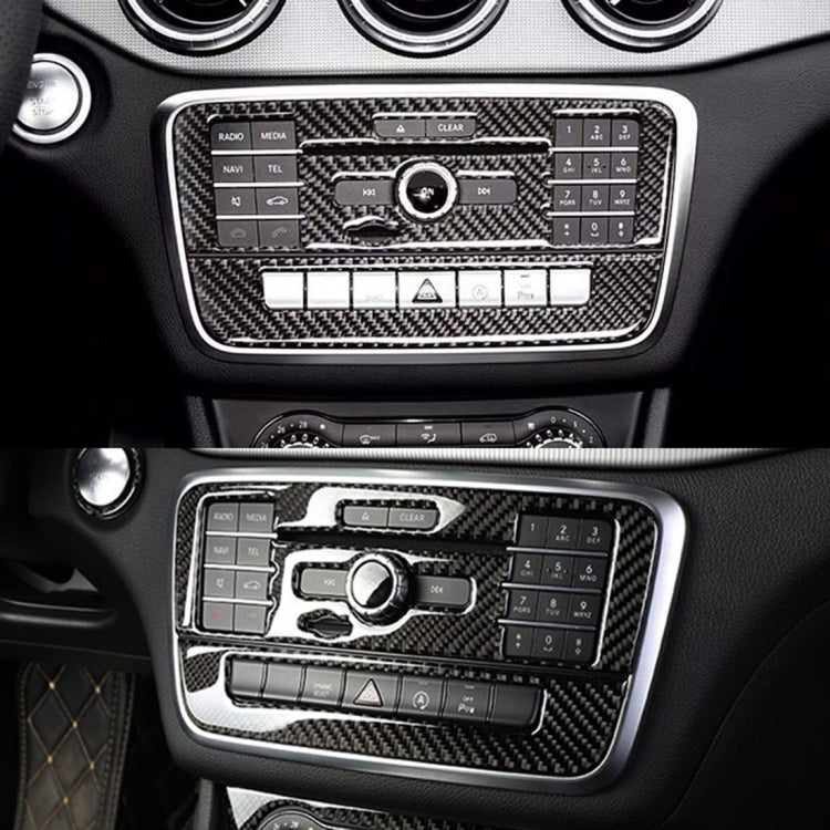 Carbon fiber CD panel trim overlays on car center console with control buttons
