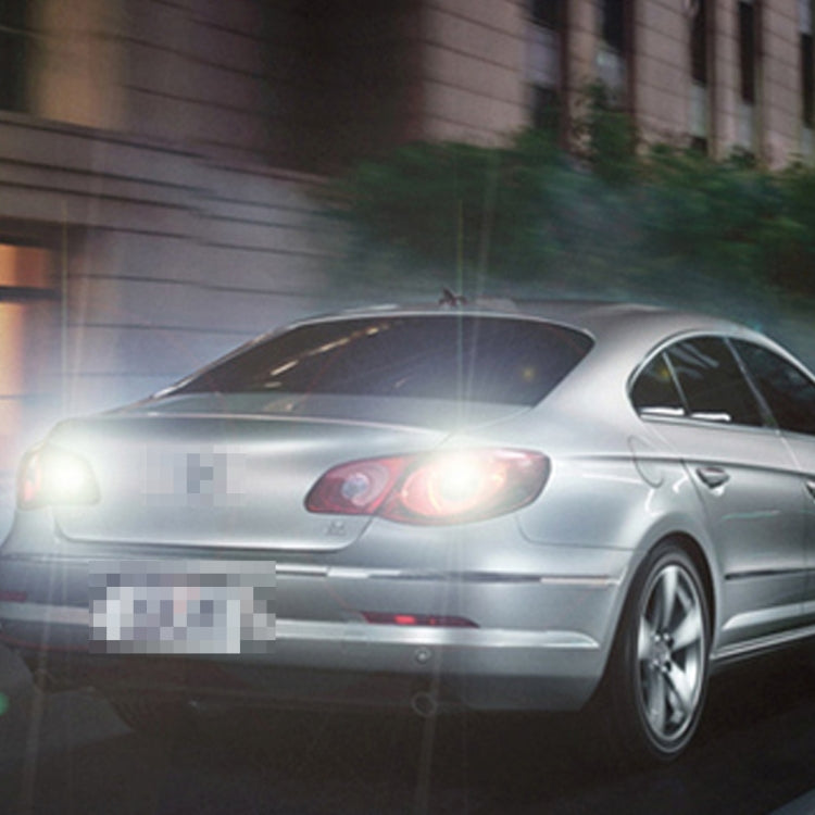 Silver car with illuminated white LED rear light